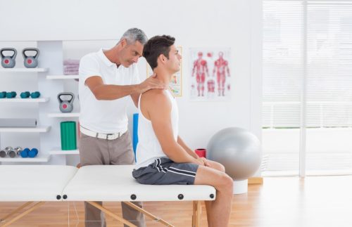 patient being examined by chiropractor
