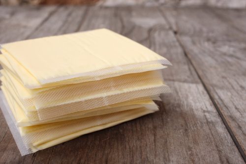 slices of American cheese in plastic