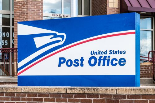 A close up of a U.S. Post Office sign