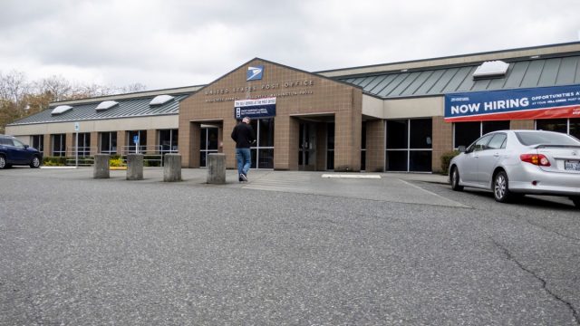 Mill Creek, WA USA - circa April 2022: Low angled view of the entrance to the Mill Creek United States Post Office building.