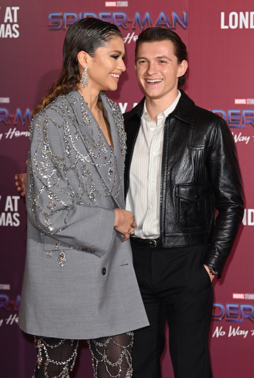 Zendaya and Tom Holland at a photocall for "Spider-Man: No Way Home" in 2021