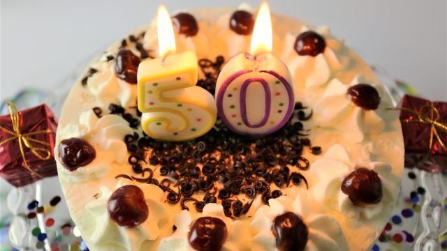 cake with candles to celebrate a 50th birthday