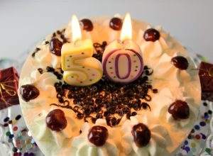 cake with candles to celebrate a 50th birthday