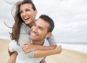 portrait of happy young couple at the beach