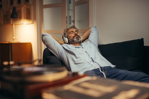 middle aged man listening to music