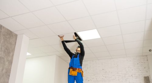 Person Working on Drop Ceiling