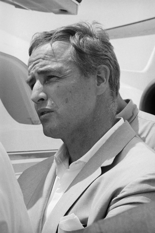 Marlon Brando waiting to board a plane in 1966