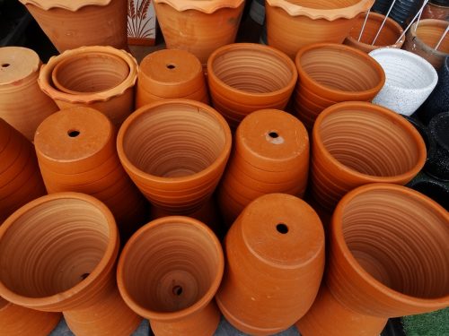 display of terra cotta pots facing up and upside down