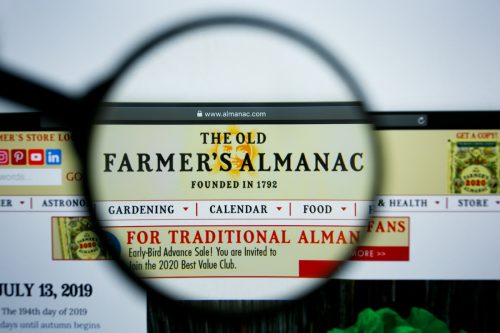 Magnifying glass over the Farmer's Almanac website.