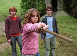 RUPERT GRINT as Ron Weasley, EMMA WATSON as Hermione Granger and DANIEL RADCLIFFE as Harry Potter