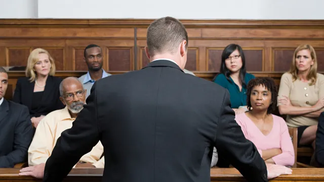 A lawyer speaking to a jury in court
