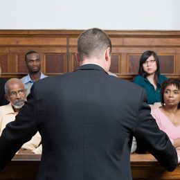 A lawyer speaking to a jury in court