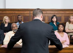 A lawyer speaking to a jury in court