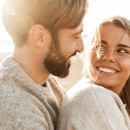man and woman embracing as he shares love messages for her