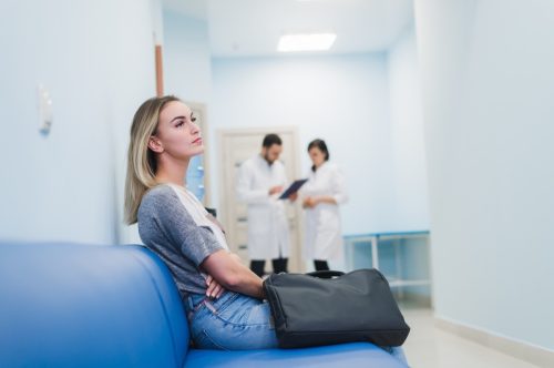 woman waiting at the hospital for an appointment