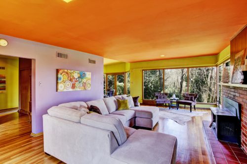 Bright living room interior with light lavender sofa