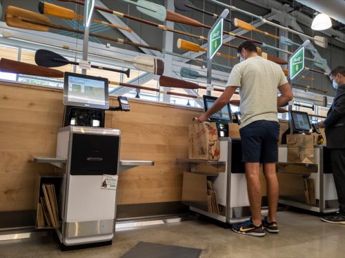 Kirkland, WA USA - circa August 2021: View of a self checkout section inside a Whole Foods market.