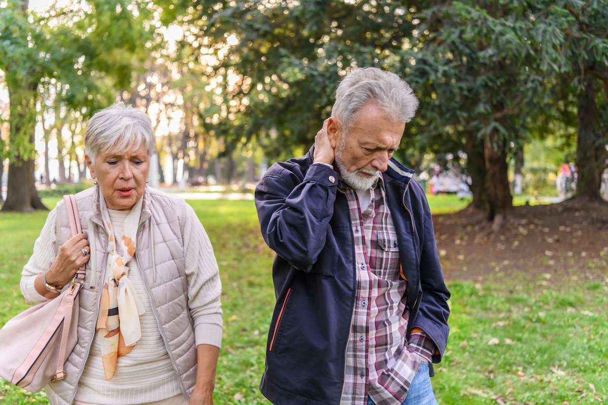 A Senior Couple is Trying to Solve the Problems While Walking in a Public Park.