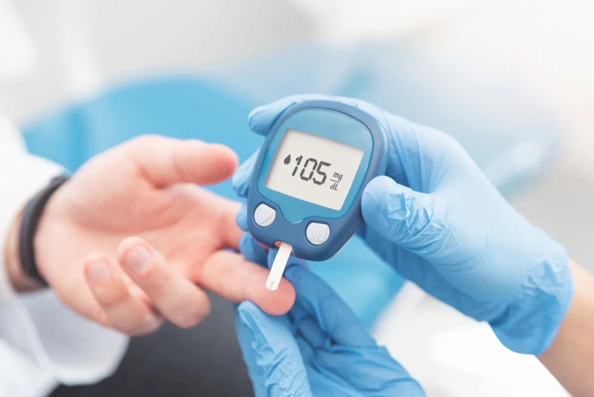 doctor checking blood sugar levels