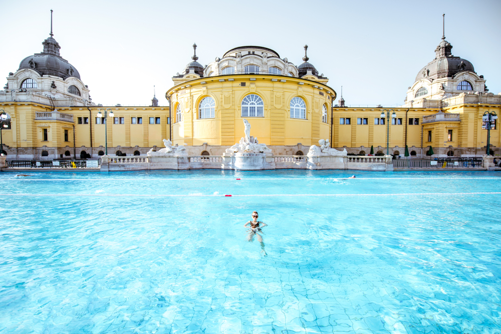 A person swimming in the Szechenyi baths and pool in Budapest, Hungary