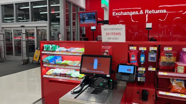A self-checkout register at a Target store showing a sign for a 10-item limit