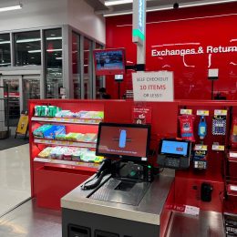 A self-checkout register at a Target store showing a sign for a 10-item limit