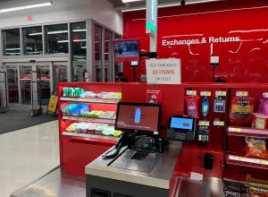 A self-checkout register at a Target store showing a sign for a 10-item limit