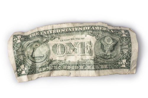 A very wrinkled and battered American one-dollar bill