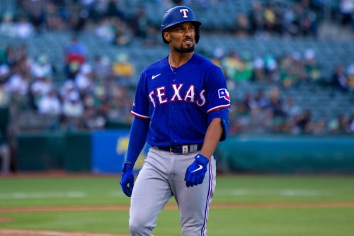 Texas Rangers second baseman Marcus Semien walks to the dugout during a game against the Oakland Athletics at the Oakland Coliseum.