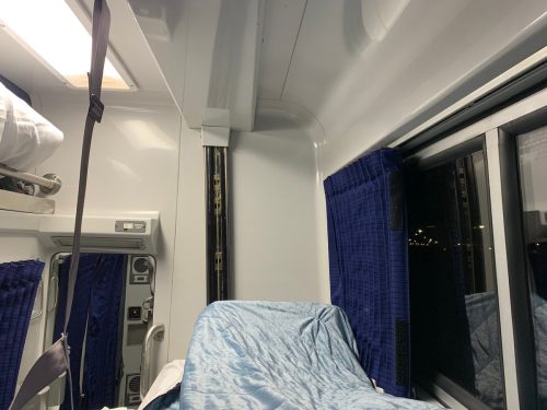bed on train suspended from the ceiling