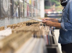 Man browsing record store