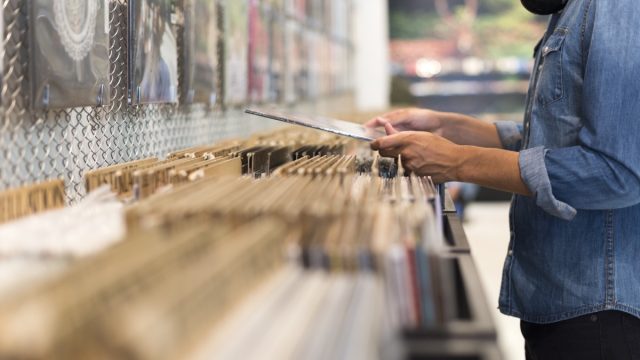 Man browsing record store