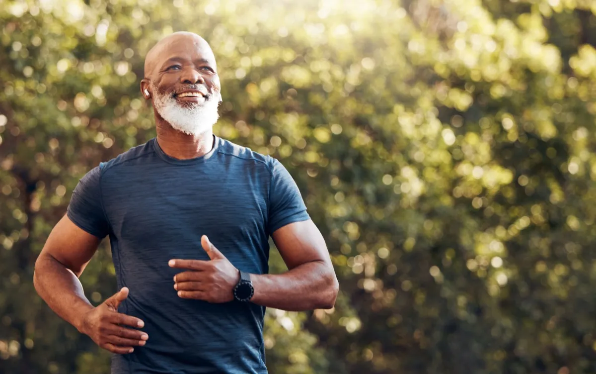 Healthy older man going for a run