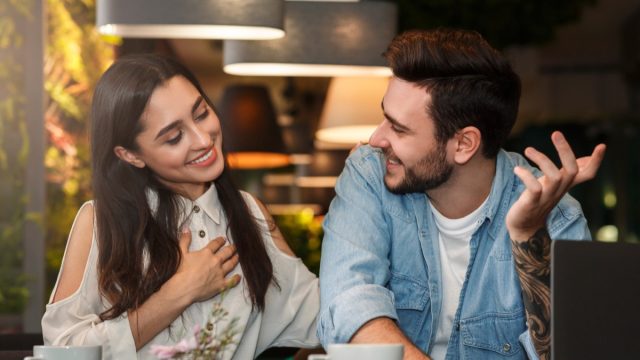 Man and Woman Flirting at Cafe