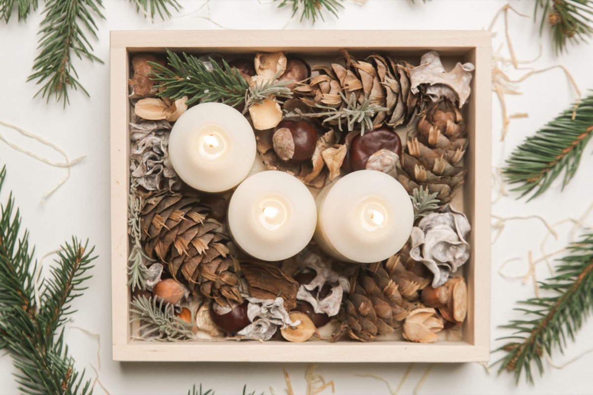 Wooden box christmas centerpiece. Simple and small home decoration with candles in wooden box.
