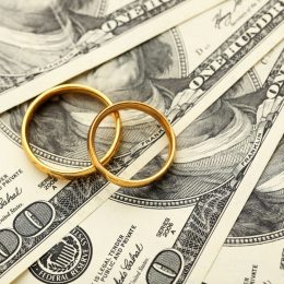 Wedding Rings on Top of Money