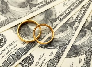 Wedding Rings on Top of Money
