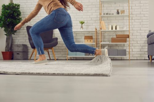 Woman Tripping on Carpet