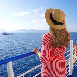 Cruise ship vacation holiday. Back view of relaxed fashion woman enjoying travel on cruise liner.