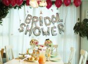 bride celebrating her upcoming wedding with balloons, table setting, and bridal shower games