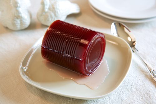 Cranberry sauce, jellied, from a can, on a white plate