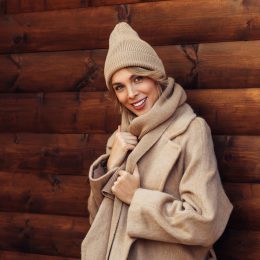 Beautiful woman in camel colored winter outfit and hat