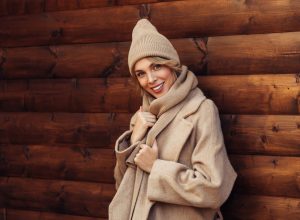 Beautiful woman in camel colored winter outfit and hat