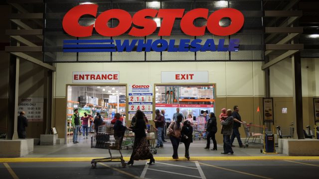Rancho Cordova, California, USA - December 1, 2016: Late evening shot of people walking in and out of a Costco Wholesale warehouse in Rancho Cordova. Costco Wholesale operates an international chain of membership warehouses, carrying brand name merchandise at substantially lower prices.