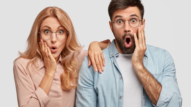 man and woman in glasses showing shock after hearing dirty pickup lines