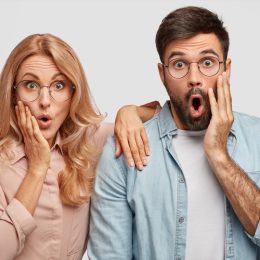 man and woman in glasses showing shock after hearing dirty pickup lines