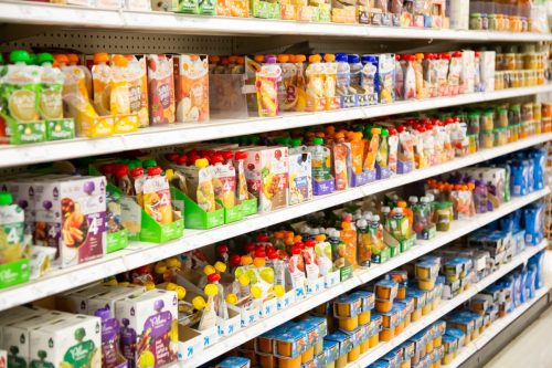 Los Angeles, California, United States - 01-04-2020: An aisle full of several varieties of baby juice pouches on display at a local grocery store.