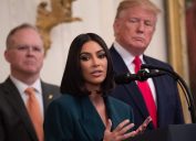 Kim Kardashian speaking at the White House alongside Donald Trump in 2019