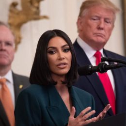 Kim Kardashian speaking at the White House alongside Donald Trump in 2019