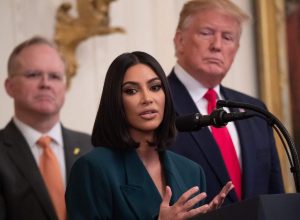 Kim Kardashian speaking at the White House alongside Donald Trump in 2019